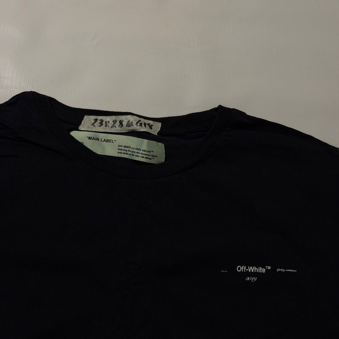 Off-White Spring Summer 2019 Black T-Shirt (Category: Tshirts & Polo Shirts ) located in Gapan. Submitted by rasthriftshop17 (Listing ID 1468021486, Image 3). Description: OFF WHITE w/back hit Size on tag: M Dimes: 23 x 28 ₱450 + sf Condition: Excellent Color rate: 9/10 Issue: None.