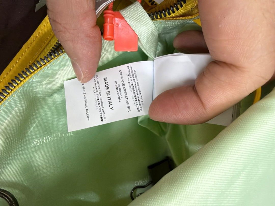 Off-White Yellow Crossbody Bag (Category: Cross-body Bags) located in Manila. Submitted by gmfhardware (Listing ID 1467839642, Image 3). Description: - Authentic Off-White crossbody bag in bright yellow - Contrasting light green interior lining with branded text pattern - Secure zip closure and snap button details - Includes functional inner zip pockets - Adjustable signature yellow industrial strap - Made in Italy tag intact - Clean canvas body,