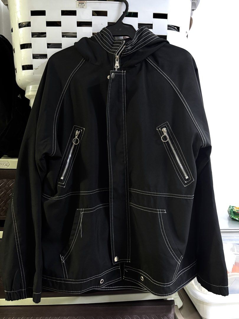 OHAC Black Hooded Jacket with White Contrast Stitching (Category: Coats, Jackets and Outerwear) located in Manila. Submitted by monami_86 (Listing ID 1468010275, Image 1). Description: Brand & Line: Unbranded / Streetwear Product Name: Black Contrast Stitch Hooded Utility Windbreaker Jacket Design: Black hooded zip-up jacket featuring bold white contrast stitching, front zipper pockets with O-ring pulls, lower patch pockets, and white back typogr