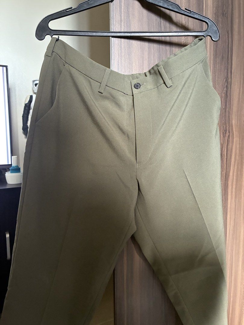 Olive Green Casual Trousers Slacks Pants (Category: Trousers) located in Las Pinas. Submitted by mrcolorless (Listing ID 1467914719, Image 1). Description: - Color: Olive green - Design: Neat pleated front with belt loops and button closure - Comfort: Elasticated waistband section at the back for a great fit - Pockets: Two back welt pockets (one with a button) - Style: Clean tailored look, ideal for work or smart casual wear - Waist: 36-39 inches