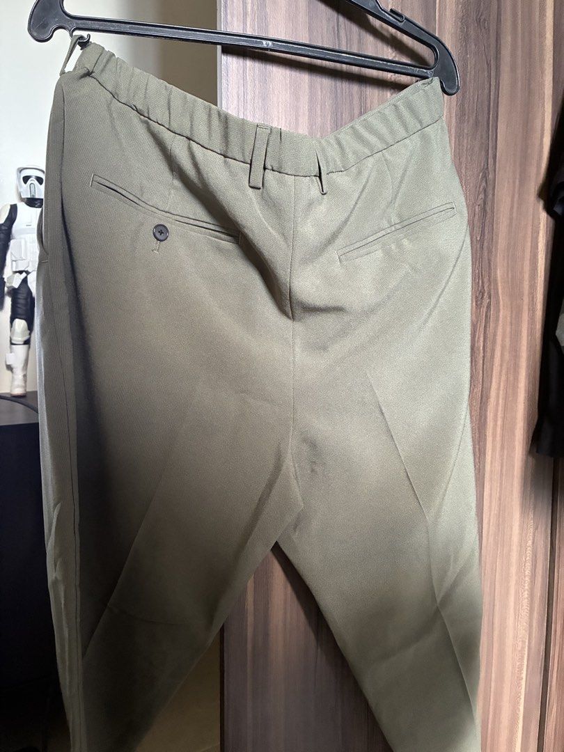 Olive Green Casual Trousers Slacks Pants (Category: Trousers) located in Las Pinas. Submitted by mrcolorless (Listing ID 1467914719, Image 2). Description: - Color: Olive green - Design: Neat pleated front with belt loops and button closure - Comfort: Elasticated waistband section at the back for a great fit - Pockets: Two back welt pockets (one with a button) - Style: Clean tailored look, ideal for work or smart casual wear - Waist: 36-39 inches