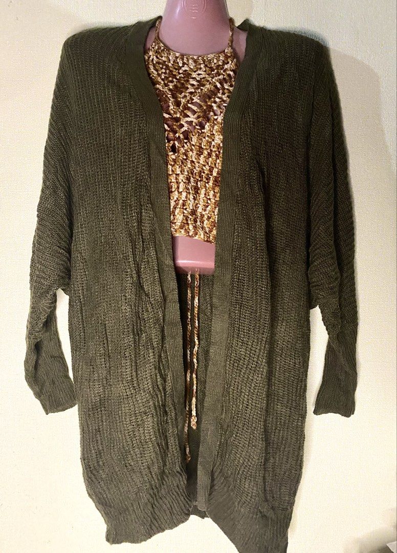 Olive Green Open Front Knit Cardigan Sweater (Category: Coats, Jackets and Outerwear) located in Las Pinas. Submitted by jewicka (Listing ID 1467989139, Image 1). Description: - Color: Olive Green - Style: Open front, relaxed oversized fit - Details: Long sleeves with ribbed cuffs - Season: Great layering piece for cooler weather - Condition: Excellent - Note: Halter top in photo not included.
