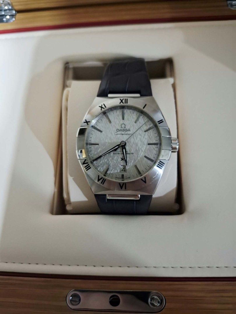 OMEGA Constellation Master Co-Axial Watch (Category: Luxury Watches) located in Manila. Submitted by piafandino36139 (Listing ID 1468026207, Image 1). Description: Omega Constellation Reference Number 131.13.39.20.06.001 Case Diameter 39 mm Case Material 316L Stainless Steel Bezel Stainless steel with blackened Roman numerals Dial Color & Finish Rhodium-grey with a unique silk-embossed pattern Hands & Markers Blackened hands, Omega logo, Constell