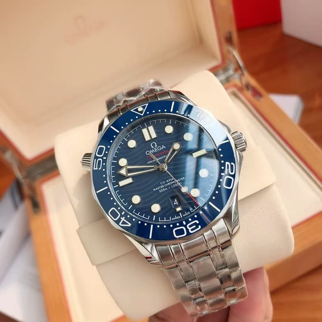 Omega Seamaster Diver 300M Blue Dial Watch (Category: Men's Watches) located in Malabon City. Submitted by ojaswibent53454 (Listing ID 1467908396, Image 3). Description: - Brand new, untouched condition (still wrapped in protective plastic straight from the wooden presentation box) - Iconic blue wave dial with matching blue bezel - Durable stainless steel case and matching steel bracelet - Reliable Swiss automatic movement with visible exhibition