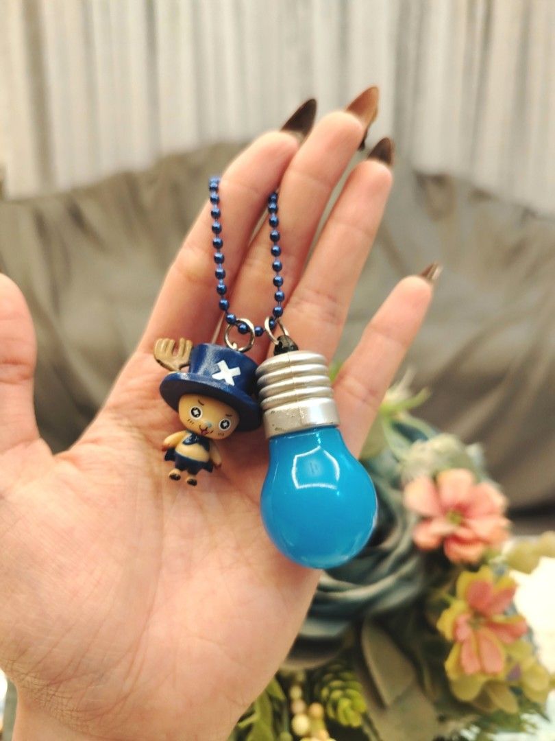 One Piece Chopper Light Bulb Keychain Charm (Category: Character Goods) located in San Fernando. Submitted by jpmarketplace2023 (Listing ID 1467919758, Image 1). Description: 💚 All items are authentic from Japan. 💛 MOP: GCash (❌️ GCash Protect) 🩵 MOD: LBC only (❌️ S. Checkout, COD, COP) 💙 Meet-up: Vista Mall, San Fernando, Pampanga 💜 All items are on-hand. 🧡 First to pay gets the item first. ❤️ Breakable items are packed with care and cauti