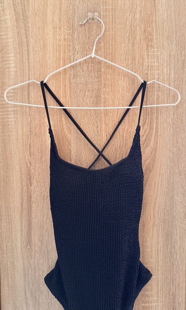 One-Piece Swimsuit – Black ribbed (Category: Bikinis & Swimsuits) located in Santa Rosa. Submitted by stealbydiva (Listing ID 1467909079, Image 1). Description: - Color: Classic Black - Fabric: Ribbed material with comfortable stretch - Straps: Adjustable criss-cross back straps with stylish metal rings - Cut: Flattering low scoop back and high-cut legs - Support: Fully lined interior with built-in padding - Condition: Used 2-3 times and high qua