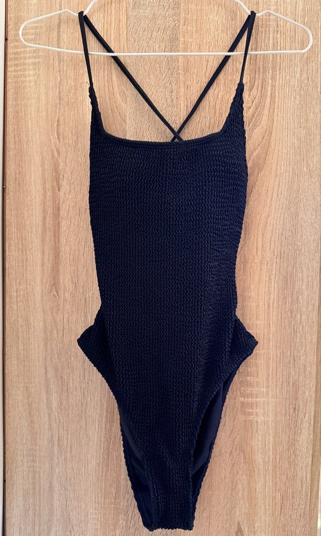 One-Piece Swimsuit – Black ribbed (Category: Bikinis & Swimsuits) located in Santa Rosa. Submitted by stealbydiva (Listing ID 1467909079, Image 2). Description: - Color: Classic Black - Fabric: Ribbed material with comfortable stretch - Straps: Adjustable criss-cross back straps with stylish metal rings - Cut: Flattering low scoop back and high-cut legs - Support: Fully lined interior with built-in padding - Condition: Used 2-3 times and high qua