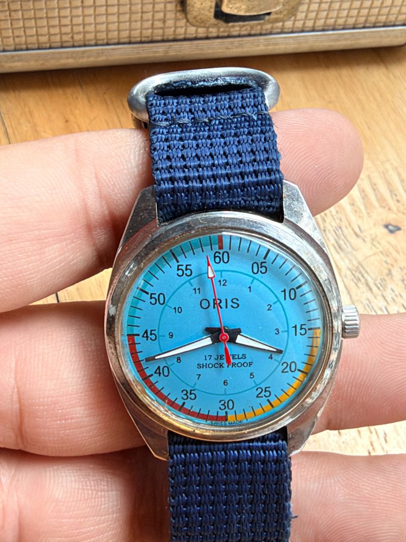 Oris Vintage Dial Chronograph Wristwatch with Blue Strap (Category: Men's Watches) located in Quezon City. Submitted by 30somethingtreasures (Listing ID 1467996708, Image 3). Description: - Authentic vintage Swiss-made Oris wristwatch - Manual wind movement with 17 jewels shock-proof feature - Striking light blue dial with vibrant, colorful segment markers - Silver-tone case with authentic signs of vintage wear - Comfortable blue nylon NATO-style