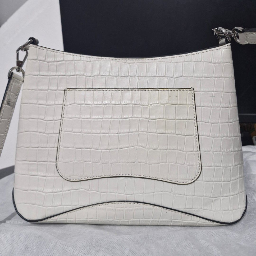 ORYANY White Shoulder Bag (Category: Shoulder Bags) located in Manila. Submitted by aimy_amour (Listing ID 1468028952, Image 2). Description: Preloved Oryany shoulder bag with dust bag. Has light yellow stains from usage but has no other flaws.