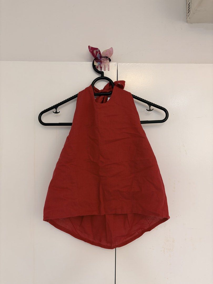 Out & About MNL Red Linen Halter Top (Category: Sleeveless) located in Quezon City. Submitted by prelovedbynxkole (Listing ID 1467884871, Image 1). Description: - Brand: Out & About MNL - Color: Bright red - Style: Halter top with adjustable back-of-neck ties and slightly curved hem - Material: Lightweight fabric - Condition: Worn once, washed, and ready to wear - Perfect for adding a pop of color to daytime outfits ALL CLOTHES NEED TO BE WASHED 