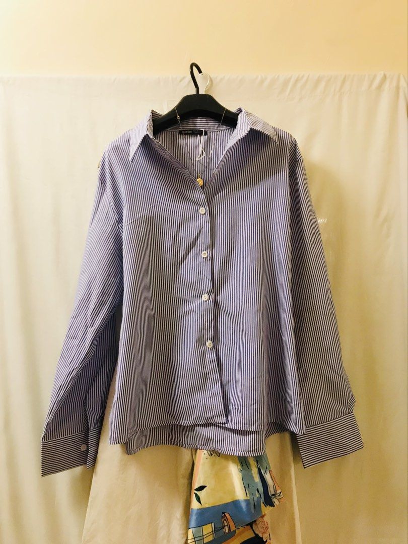 Oversized stripes buttondown light blue (Category: Blouses) located in Manila. Submitted by 414studio (Listing ID 1468044399, Image 2). Description: Free size Good quality In good condition (Scarf and accessories are not included) .