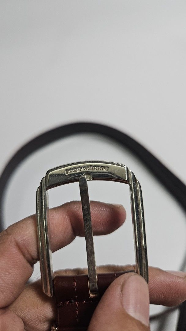 Paco Rabanne Leather Belt (Category: Belts) located in Alfonso. Submitted by jbcamet (Listing ID 1467980512, Image 2). Description: - Brand: Paco Rabanne - Condition: Brand new with original store tag attached - Material: 100% genuine cowhide leather - Color: Rich burgundy - Hardware: Silver-tone metal buckle with engraved branding - Design: Detailed stitching pattern along the strap with classic styling - Versatility: Great accessory for both fo