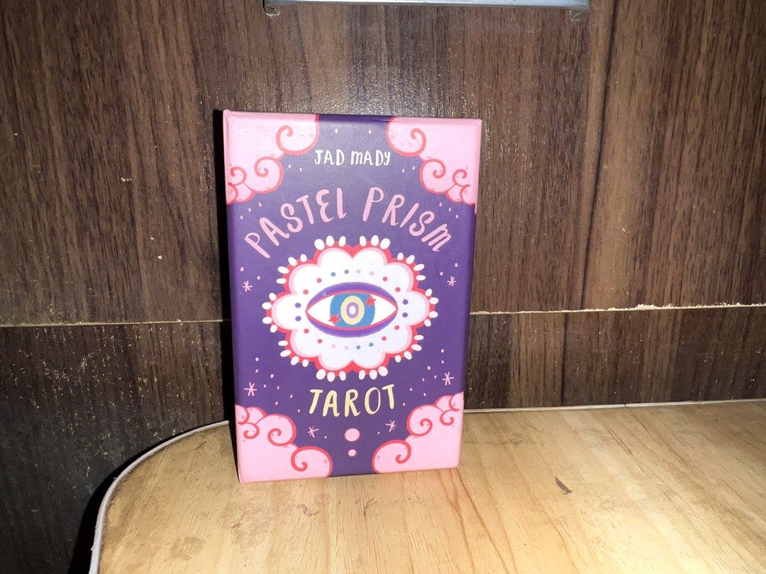 Pastel Prism Tarot by Jad Mady (Category: Storybooks) located in Manila. Submitted by va1nblxxd (Listing ID 1467993335, Image 1). Description: — High Quality [All cards complete] — Barely used at all because i got other tarot card decks lol. — Cleansed ! — super negotiable selling price, needa get rid of it for spacee • Originally bought for: 2.5k PHP Reason for Selling: As mentioned previously i am making spaces for other decks, and i barely use
