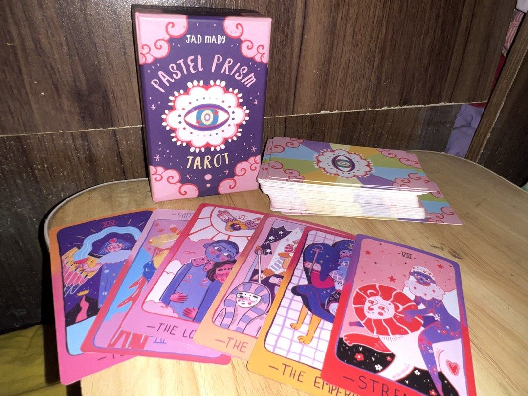Pastel Prism Tarot by Jad Mady (Category: Storybooks) located in Manila. Submitted by va1nblxxd (Listing ID 1467993335, Image 2). Description: — High Quality [All cards complete] — Barely used at all because i got other tarot card decks lol. — Cleansed ! — super negotiable selling price, needa get rid of it for spacee • Originally bought for: 2.5k PHP Reason for Selling: As mentioned previously i am making spaces for other decks, and i barely use