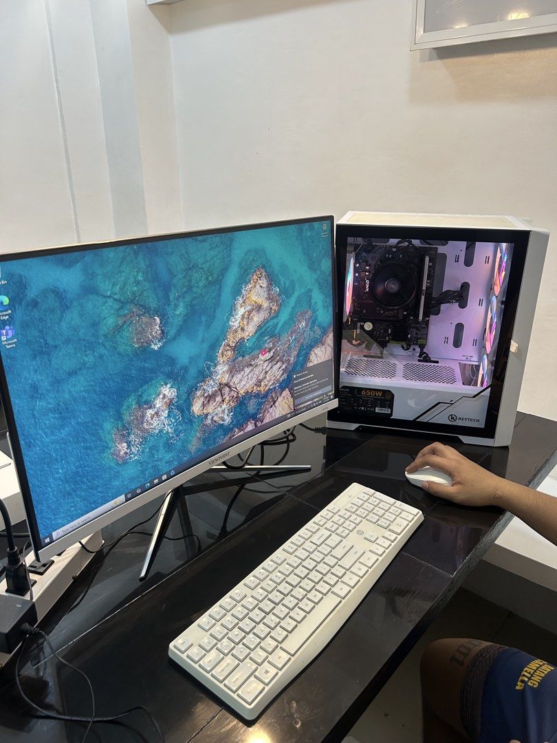 PC set lightly used PLS Check specs (Category: Desktops) located in Manila. Submitted by jillobeats (Listing ID 1467882962, Image 1). Description: - Processor: AMD Ryzen 5 5600G - Memory: 8GB RAM - Storage: 512GB SSD - Display & Peripherals: Viewpoint monitor, white keyboard, and mouse included - Case & Power Supply: Keytech casing with Inplay GS650 PSU - Condition: Fully working, smooth performance for daily tasks and basic gaming - Extras: Stor