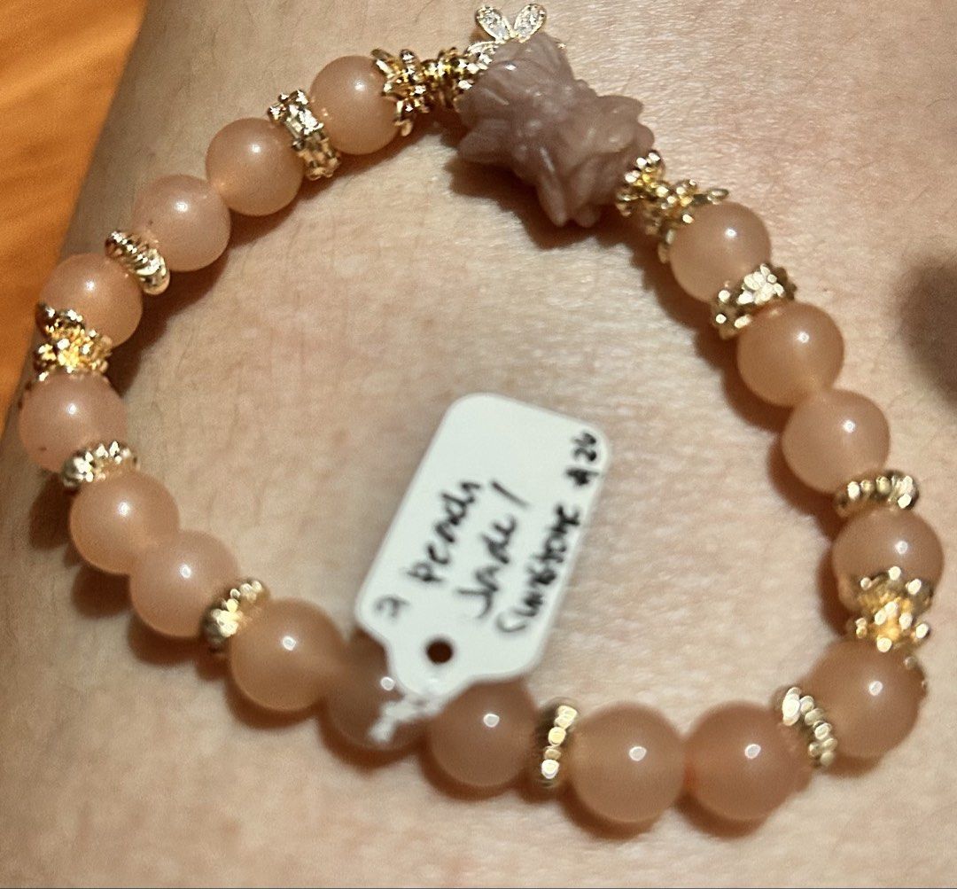 Peach Jade Sunstone Bracelet with Charm (Category: Bracelets) located in Marikina City. Submitted by tresariascats (Listing ID 1467917167, Image 1). Description: - Material: Genuine peach jade and sunstone beads - Accents: Gold-colored spacers and an adorable flower-shaped carved charm - Fit: Stretch band style for easy slip-on wear - Condition: Brand new with $20 price tag still attached - Perfect for daily wear or gifting! Beads size 8.