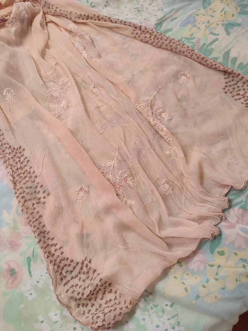 Peach Scarf Floral Embroidery Beaded Edging (Category: Scarves) located in Jaen. Submitted by roxantiago (Listing ID 1468039254, Image 3). Description: - Color & Design: Light pink peach with embroidered floral patterns and a brown patterned border - Details: Tiny white beads along the lovely wavy hem - Material: Lightweight and soft with a crinkled texture - Styling: Perfect for wrapping around the neck or draping over shoulders - Condition: Exc