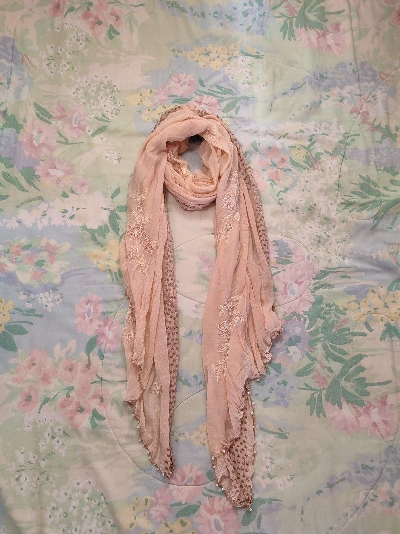 Peach Scarf Floral Embroidery Beaded Edging (Category: Scarves) located in Jaen. Submitted by roxantiago (Listing ID 1468039254, Image 1). Description: - Color & Design: Light pink peach with embroidered floral patterns and a brown patterned border - Details: Tiny white beads along the lovely wavy hem - Material: Lightweight and soft with a crinkled texture - Styling: Perfect for wrapping around the neck or draping over shoulders - Condition: Exc