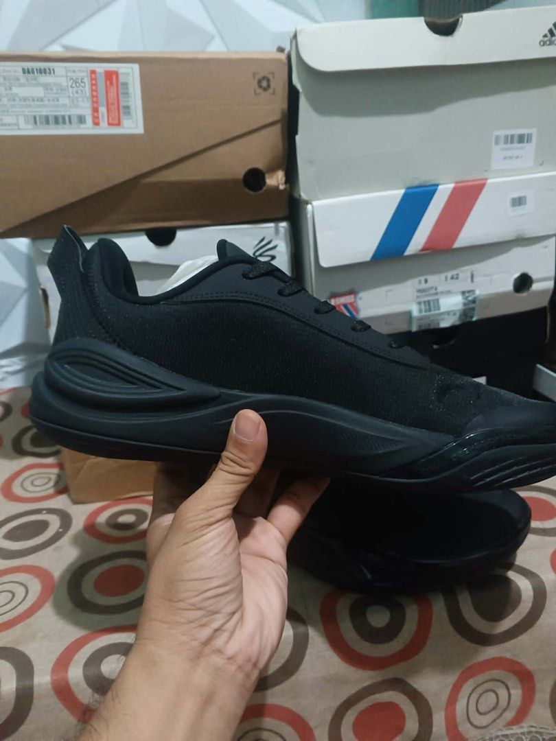 Peak Black Athletic Sneakers (Category: Sneakers) located in Manila. Submitted by lizy_dms (Listing ID 1467930275, Image 3). Description: - Brand: Peak - Style: Low-top sneakers - Color: All black - Upper: Fabric with reinforced overlays for durability - Sole: Cushioned midsole with curved lines and textured grip rubber outsole - Design Details: Signature triangular logo on the side - Convenience: Padded collar and heel pull tab for easy wear - C