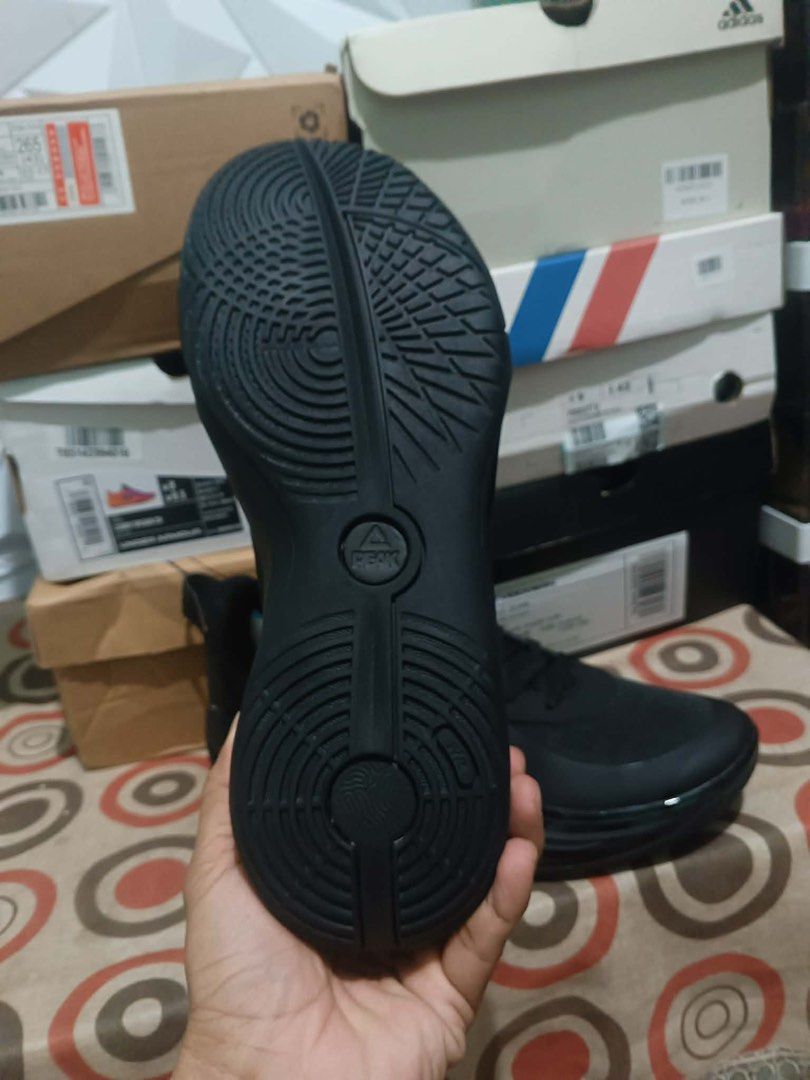 Peak Black Athletic Sneakers (Category: Sneakers) located in Manila. Submitted by lizy_dms (Listing ID 1467930275, Image 2). Description: - Brand: Peak - Style: Low-top sneakers - Color: All black - Upper: Fabric with reinforced overlays for durability - Sole: Cushioned midsole with curved lines and textured grip rubber outsole - Design Details: Signature triangular logo on the side - Convenience: Padded collar and heel pull tab for easy wear - C