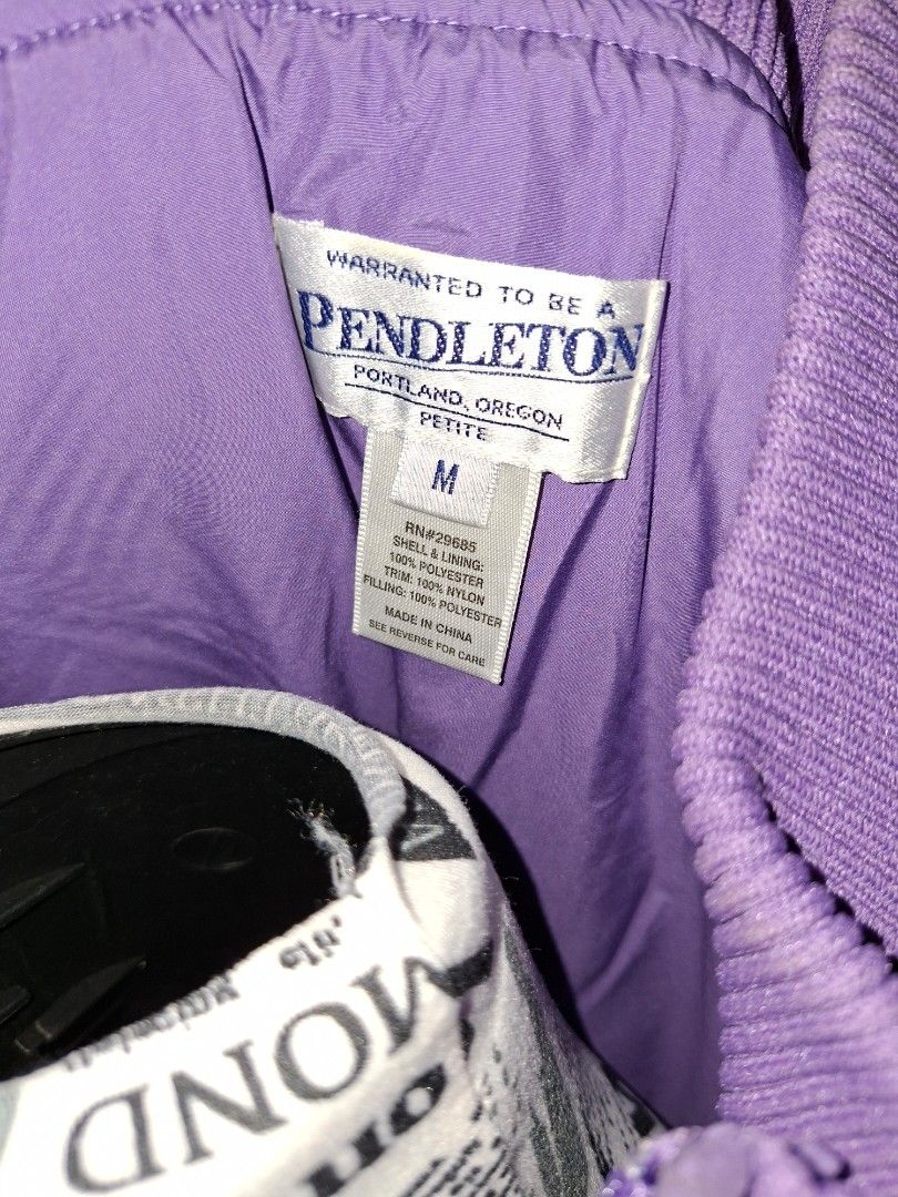 Pendleton Purple Quilted Petite Vest Size M (Category: Vests) located in Manila. Submitted by mialiurshop (Listing ID 1467901324, Image 2). Description: - Brand: Pendleton - Color: Bright purple - Size: Medium (Petite fit) - Design: Diamond quilted pattern with full zip front - Details: Ribbed collar and arm openings - Origin: Made in China (material details on inner tag).