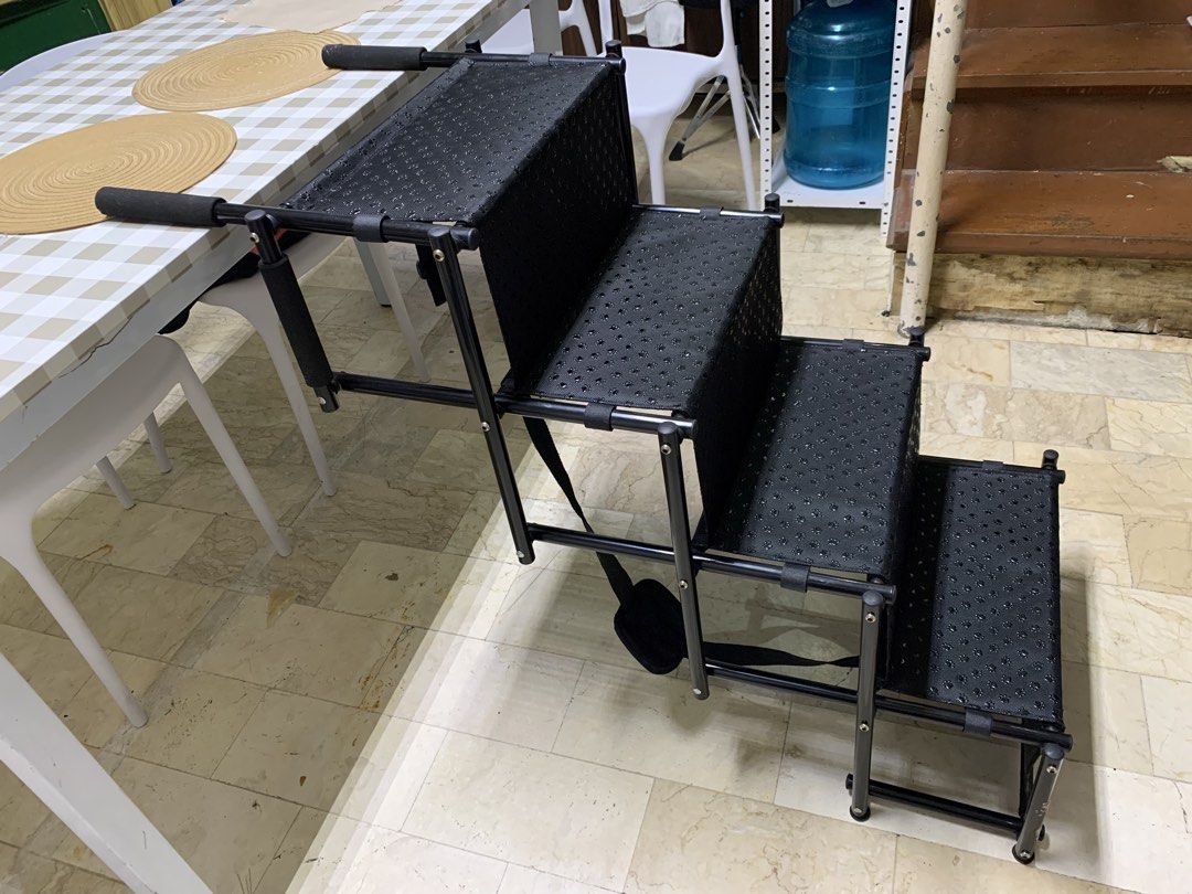 Petsafe Foldable 4-Step Portable Pet Stairs Black with Paw Print Pattern (Category: Ladders & Steps) located in Paranaque City. Submitted by seb_trading (Listing ID 1467926177, Image 1). Description: - Color: Sleek black with cute paw print pattern on treads - Ideal For: Small dogs and cats, especially senior pets needing help reaching beds or couches - Sturdy Design: Durable metal frame with comfortable foam/fabric steps - Convenient Features: P