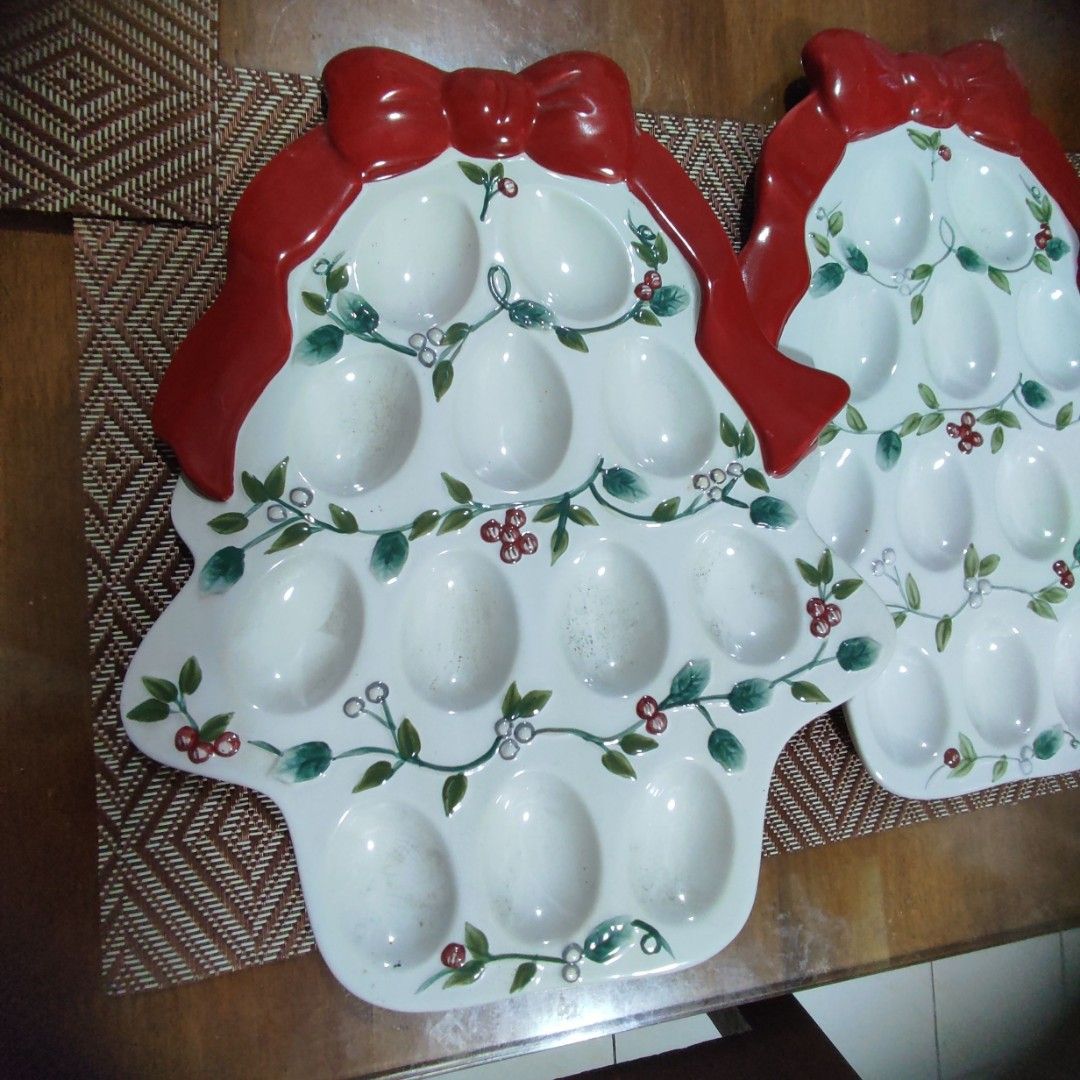 Pfaltzgraff Winterberry Christmas Tree Egg Tray Platter (2 Pcs) (Category: Dinnerware & Cutlery) located in Las Pinas. Submitted by lawki_stuff (Listing ID 1467852006, Image 1). Description: Pfaltzgraff Winterberry Deviled Egg Plate Shaped like Cristmas Tree & decorated with holly, mistletoe & a large red bow at the top Serving dish for 12 egg placement Safe for the dishwasher & microwave Crafted from durable earthware or stoneware Size 12"x10" V