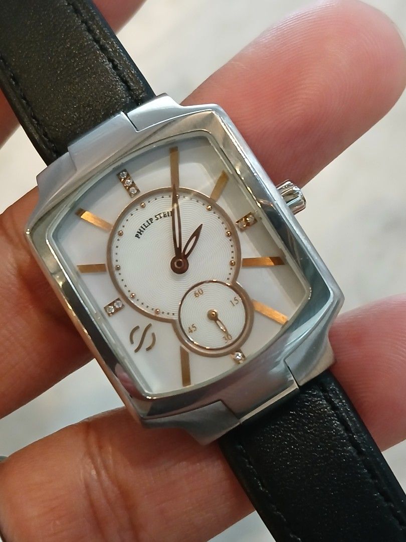 Philip stein square diamonds (Category: Women's Watches) located in Manila. Submitted by hondaesi41 (Listing ID 1467950884, Image 1). Description: Steal price! Rare! sure buyer only Original philip stein square type w/diamonds Unit and replacement box only original rubber strap included ksama na. Replacement leather strap 9/10 few hairlines on the glass.the rest makinis Price:9.5k only.fixed Msrp:45k DM/if interested Thank you!.