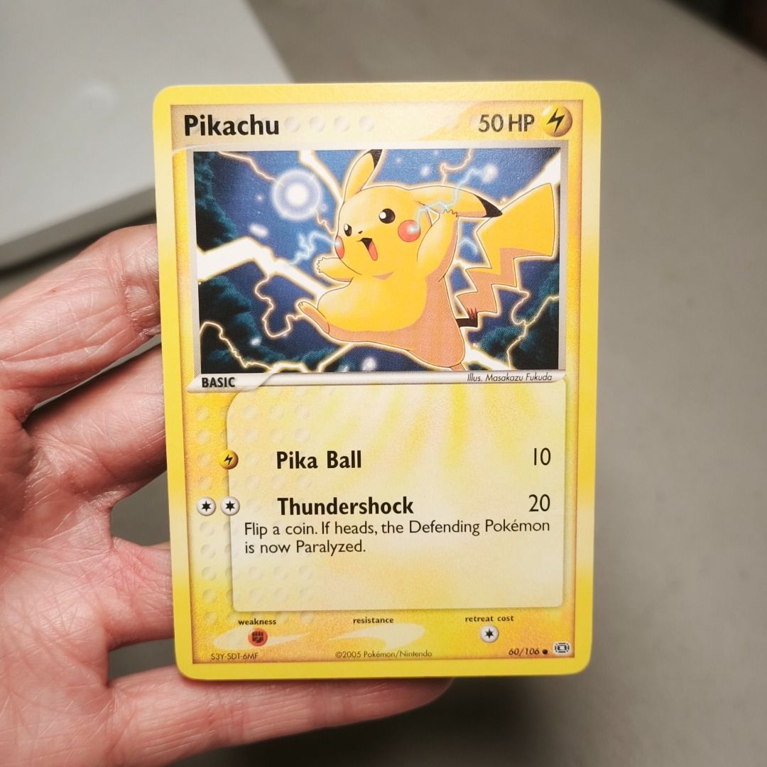 Pikachu 60/106 (Category: Raw Singles) located in Quezon City. Submitted by sherylneri (Listing ID 1467943787, Image 1). Description: 2005 Pokemon EX - Pikachu | EX Emerald | 60/106 | EN 💯 Original 💯 Authentic • Card condition is indicated in the photo. (MT) Mint (NM) Near Mint (EX) Excellent (GD) Good (PR) Poor • Can send additional photos/videos upon request. • Manage your expectations for vintage cards. • ALL CARDS are sleeved and encased in
