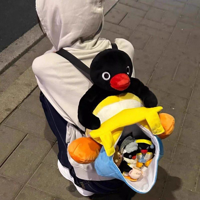 Pingu Plush Backpack Soft Toy Penguin Bag (Category: Plushies & Soft Toys) located in Cainta. Submitted by shopbyyna (Listing ID 1467864696, Image 2). Description: - Super cute Pingu plush backpack - Soft black and white body with bright orange feet and a big red beak - Front blue and yellow pouch compartment with 'Pingu' embroidered in red - Adjustable black straps for a comfortable fit - Fun conversation starter or quirky everyday carry-all.