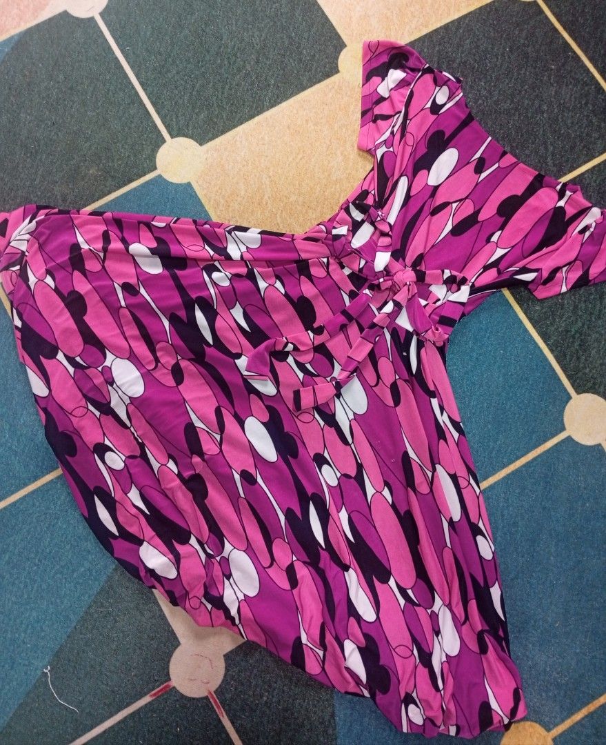 Pink Abstract Print Wrap Dress (Category: Dresses) located in Santa Maria. Submitted by itsmacmacky (Listing ID 1468002599, Image 2). Description: Pink Abstract Print Wrap Dress Brand: None Size: Small to Medium Material: Lightweight, smooth fabric with black inner lining Design: Pink, black, and white abstract print; short sleeves; V-neckline; wrap-style front with waist tie Style: Casual / Feminine Wrap Dress.