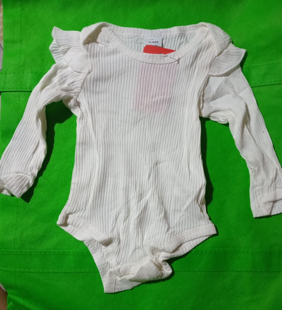 Pink and White Houndstooth Duck Tunic Top (Category: Other Babies Going Out Needs) located in Quezon City. Submitted by macon0948 (Listing ID 1467894228, Image 3). Description: - Pink and white houndstooth pattern - Adorable embroidered mother duck and ducklings with blue bows at the bottom - Sweet ruffle trim across the chest - Convenient button closures at the shoulders and side - Sleeveless design - Chest width: approx. 13 inches.