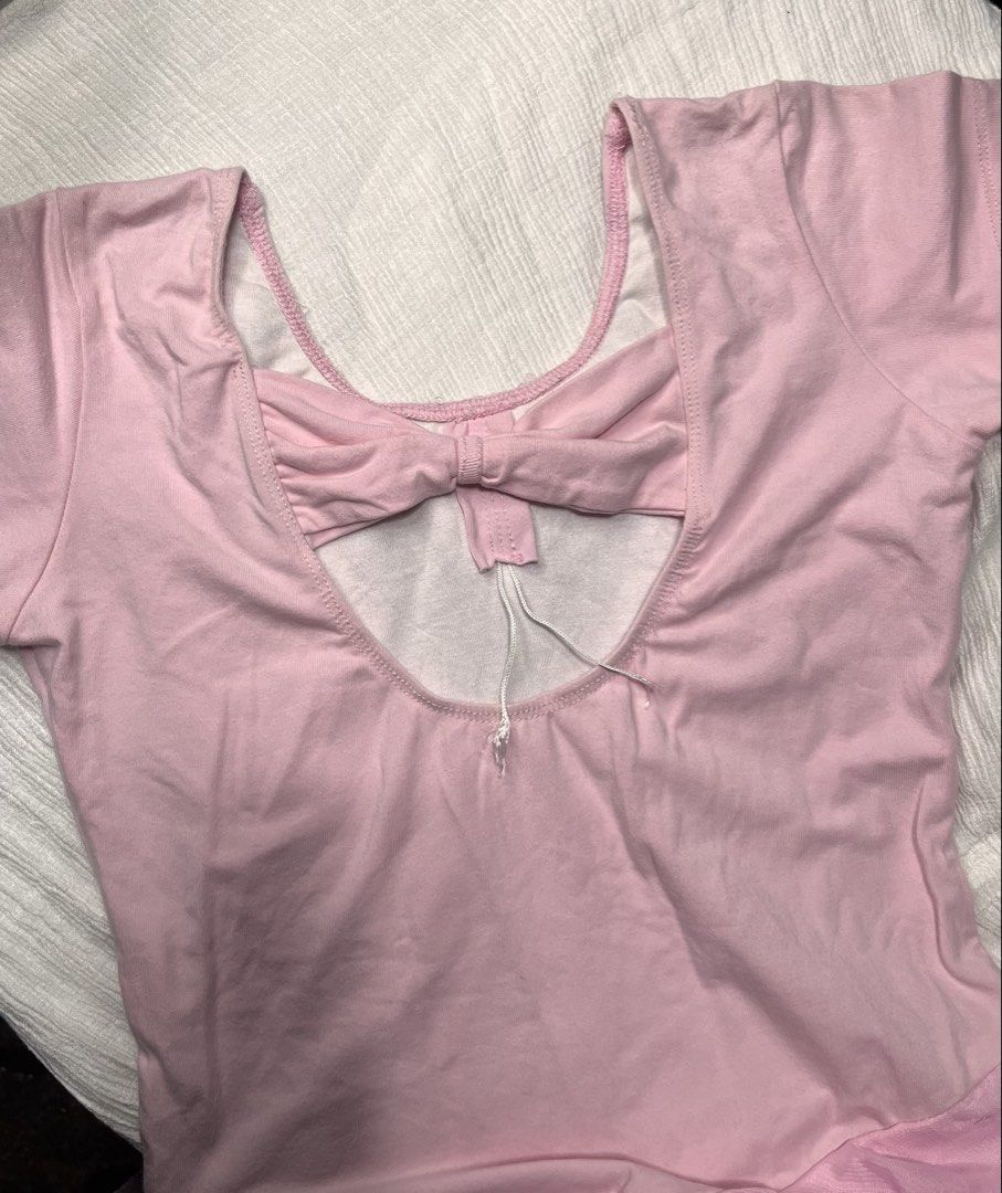 Pink Ballet Skirted Leotard with Back Bow (Category: Babies & Kids Fashion) located in General Mariano Alvarez. Submitted by kascade (Listing ID 1468052139, Image 2). Description: - Color: Pink - Style: Short-sleeve ballet leotard with attached chiffon skirt - Neckline: Scoop front and back - Feature: Cute bow detail on the upper back strap - Material: Soft and stretchy fabric - Ideal for: Dance class or recitals.