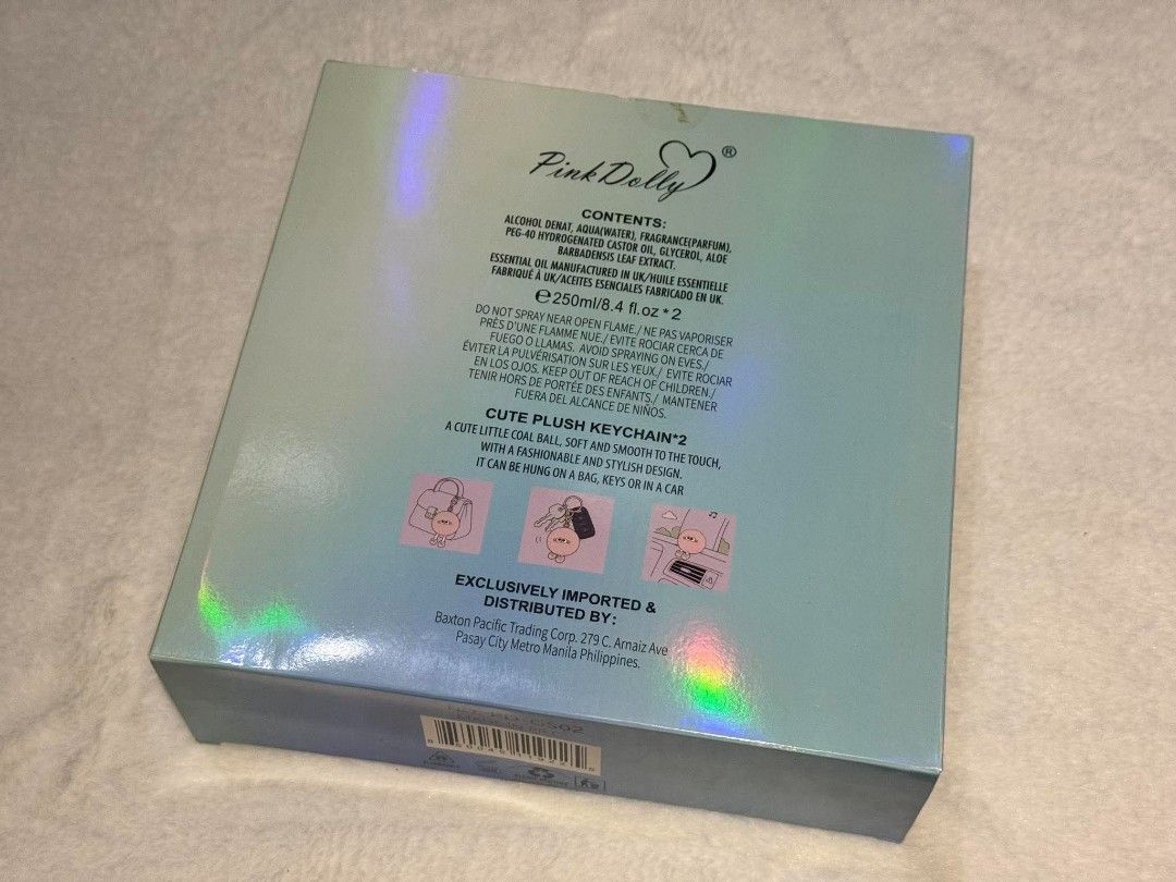 Pink Dolly Crystal Petal & Cuddle Bliss Gift Set (Category: Fragrance & Deodorants) located in Quezon City. Submitted by trade_mnl (Listing ID 1468057515, Image 2). Description: - Brand new & unopened Pink Dolly gift set - 2x 250ml body mists: Crystal Petal and Cuddle Bliss - 2x cute plush keychains with googly eyes (white and pink) - Stunning holographic packaging with floral patterns - Perfect and ready-to-give present for fragrance lovers.