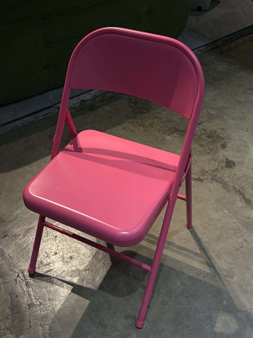 Pink Metal Folding Chair (Category: Chairs) located in Manila. Submitted by gladysshanee (Listing ID 1467941184, Image 1). Description: - Color: Bright pink - Material: Sturdy steel frame with smooth seat and backrest - Design: Folds completely flat for easy storage in tight spaces - Condition: Clean with no major dents or scratches - Perfect for: Extra seating in rooms, balconies, or gatherings.