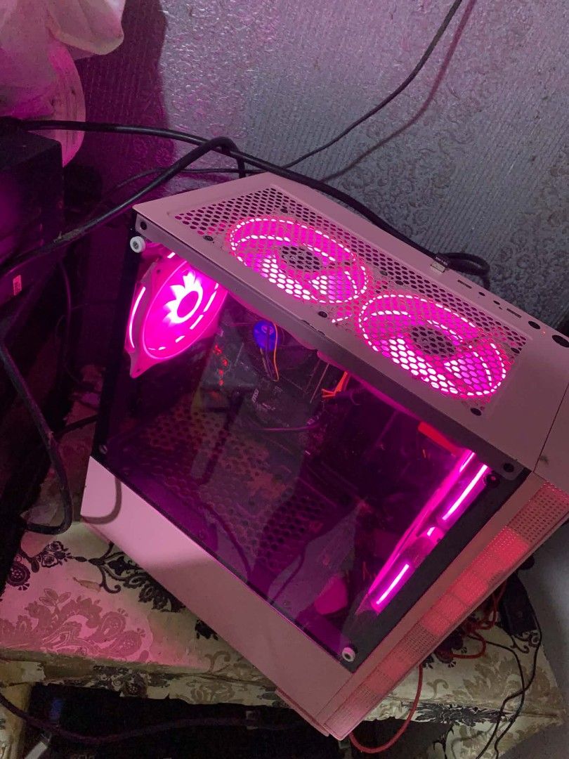 Pink PC Intel i5-6500 8GB RAM 120GB SSD (Category: Desktops) located in Manila. Submitted by sett_30 (Listing ID 1468036182, Image 1). Description: Pink desktop setup running an Intel i5-6500 processor at 3.20GHz. Has 8.00GB of installed RAM and a 128GB Ramsta SSD S800 storage drive. Case includes multiple pink glowing RGB fans on the top, back, and front. Motherboard is an MSI model. No dedicated graphics card installed currently. Clean pink sid