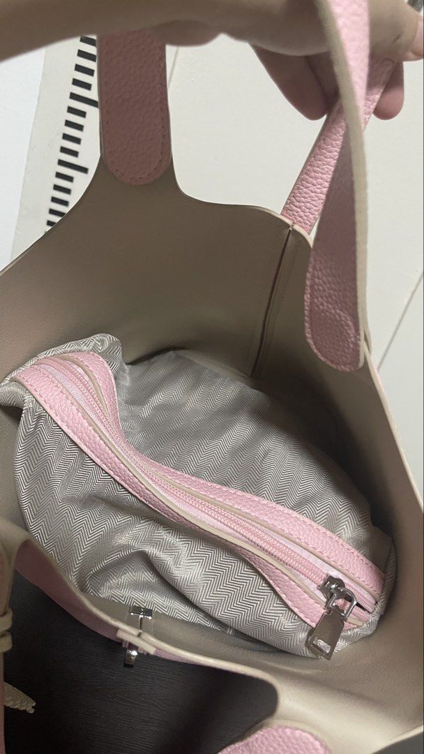 Pink Tote Bag with Pegasus Charm (Category: Tote Bags) located in Magalang. Submitted by josephinenl (Listing ID 1467898404, Image 3). Description: - Stylish textured pink bucket tote with sturdy handles - Elegant silver-tone lock hardware closure - Comes with a matching pegasus-shaped bag charm with white wings - Includes a zippered interior organizer pouch in grey herringbone fabric with pink trim - Perfect everyday bag for work, casual outings