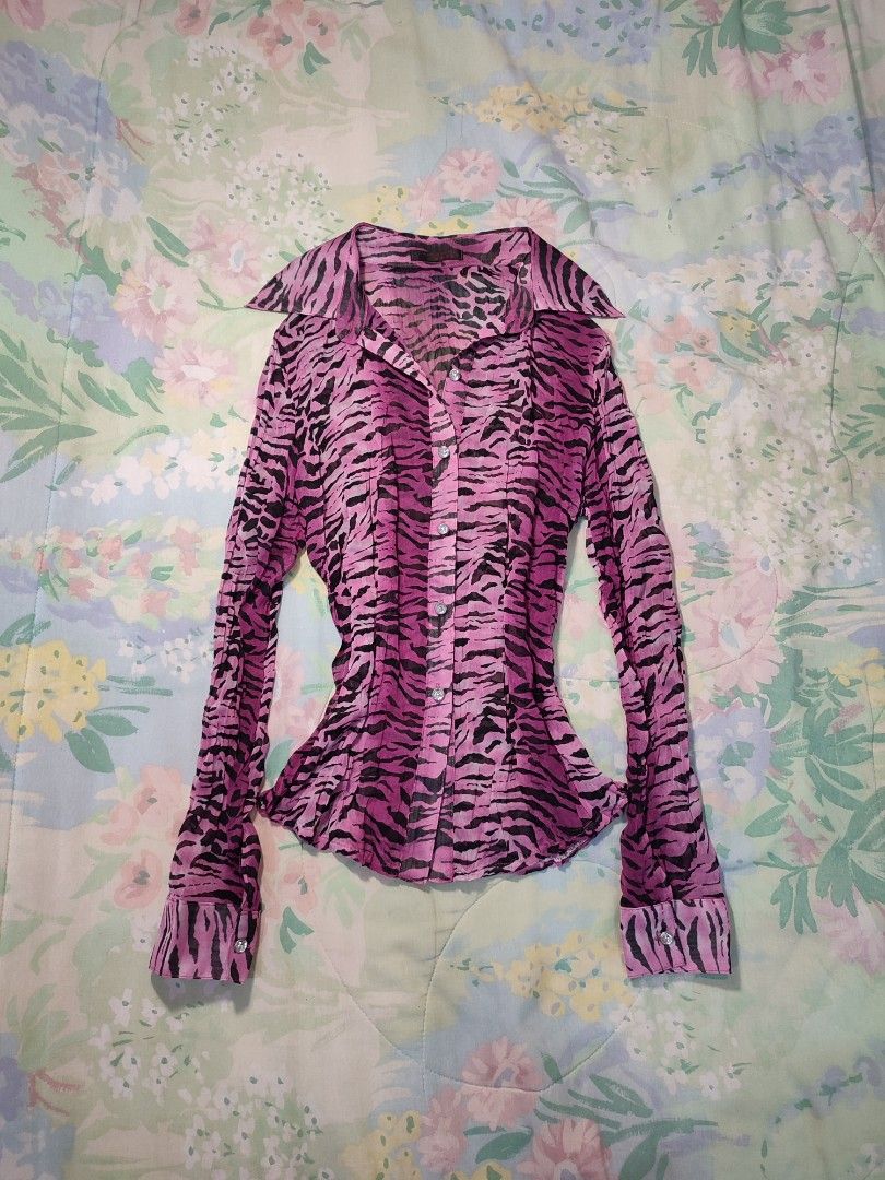 Pink Zebra Print Button-Up Blouse (Category: Blouses) located in Jaen. Submitted by roxantiago (Listing ID 1468038706, Image 1). Description: xs to s - Design: Pink & black animal print with crinkled sheer texture - Fit: Fitted silhouette with long sleeves and pointed collar - Details: Sparkly rhinestone buttons down the front and at cuffs - Condition: Excellent pre-loved condition - Mode of Payment: GCash, BPI, or Maya - Shipping: Fast shipping 