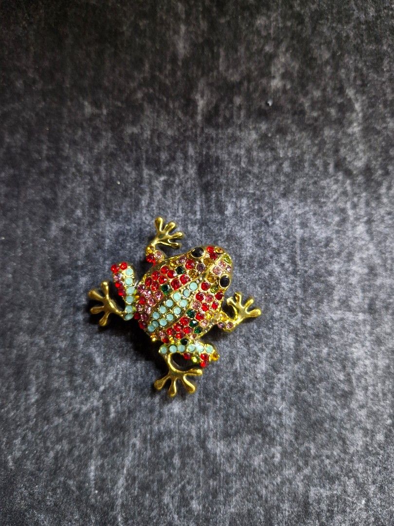 Pioson Frog Brooch 2 (Category: Brooches) located in Taguig. Submitted by mommaschoice (Listing ID 1467962027, Image 1). Description: Brand New Beautifully crafted design Adorned w/ mix colored rhinestones Lightweight won't damage the fabric Ships nationwide.
