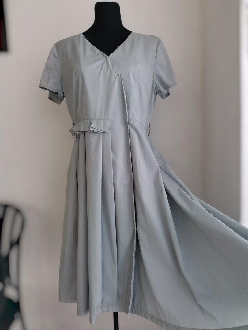 Pleated Snap-front Midi Dress (Large-XL) (Category: Dresses) located in Quezon City. Submitted by engeleaize (Listing ID 1467867792, Image 3). Description: Details: Color: Muted/Mineral Gray Style: A-line style dress, Asymmetric wrap bodice, V-neckline, snap-front buttons, structured waist pleats, belt loops Fabric: Cotton-nylon-spandex Best worn: Smart casual, workplace, sightseeing Bust: 38-40 inches Waist: 34 inches Length: 45 inches Best fit: