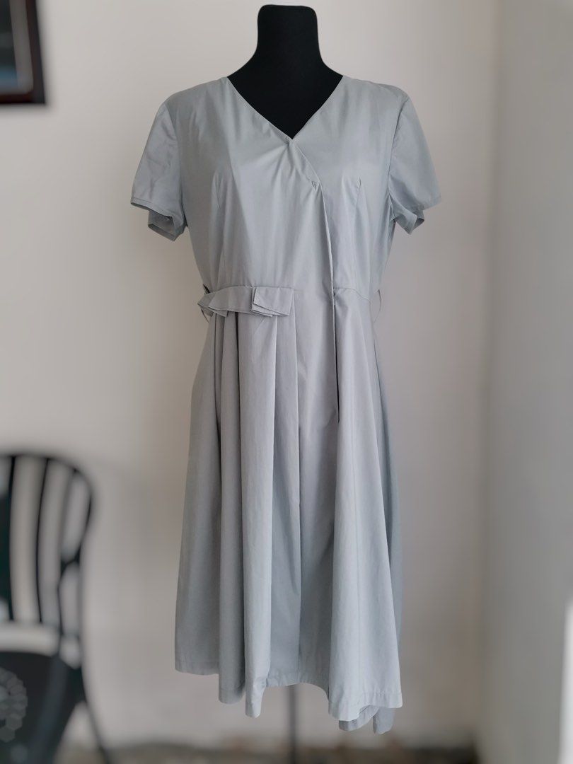 Pleated Snap-front Midi Dress (Large-XL) (Category: Dresses) located in Quezon City. Submitted by engeleaize (Listing ID 1467867792, Image 1). Description: Details: Color: Muted/Mineral Gray Style: A-line style dress, Asymmetric wrap bodice, V-neckline, snap-front buttons, structured waist pleats, belt loops Fabric: Cotton-nylon-spandex Best worn: Smart casual, workplace, sightseeing Bust: 38-40 inches Waist: 34 inches Length: 45 inches Best fit:
