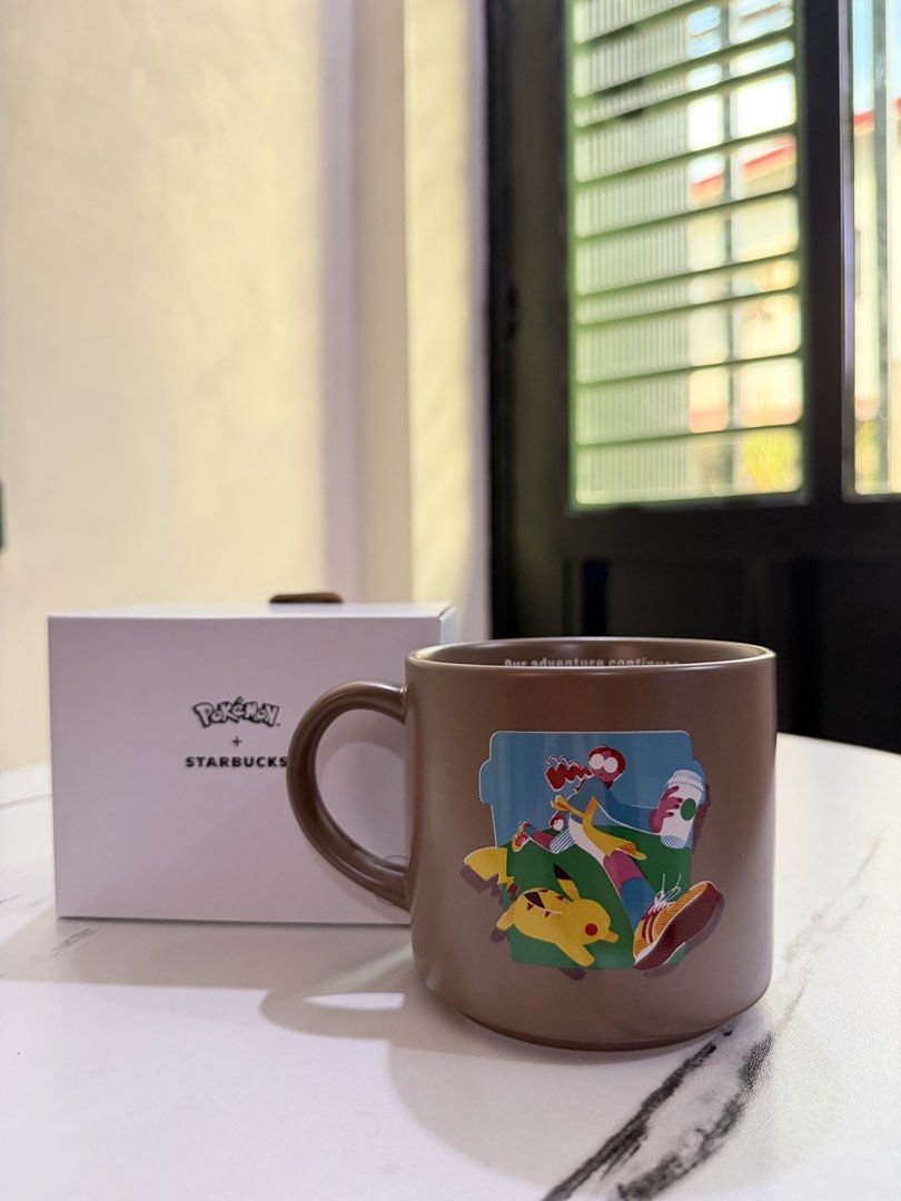 Pokemon x Starbucks Brown Ceramic Mug with Box (Category: Coffee & Tea Tableware) located in Valenzuela. Submitted by sel000 (Listing ID 1467991196, Image 1). Description: - Authentic Starbucks x Pokémon collaboration - Brown ceramic mug featuring Pikachu graphic on one side and Starbucks siren logo on the other - Includes original white box - Perfect for daily use or collection - Condition: Brand new.