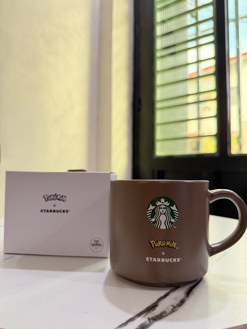 Pokemon x Starbucks Brown Ceramic Mug with Box (Category: Coffee & Tea Tableware) located in Valenzuela. Submitted by sel000 (Listing ID 1467991196, Image 2). Description: - Authentic Starbucks x Pokémon collaboration - Brown ceramic mug featuring Pikachu graphic on one side and Starbucks siren logo on the other - Includes original white box - Perfect for daily use or collection - Condition: Brand new.