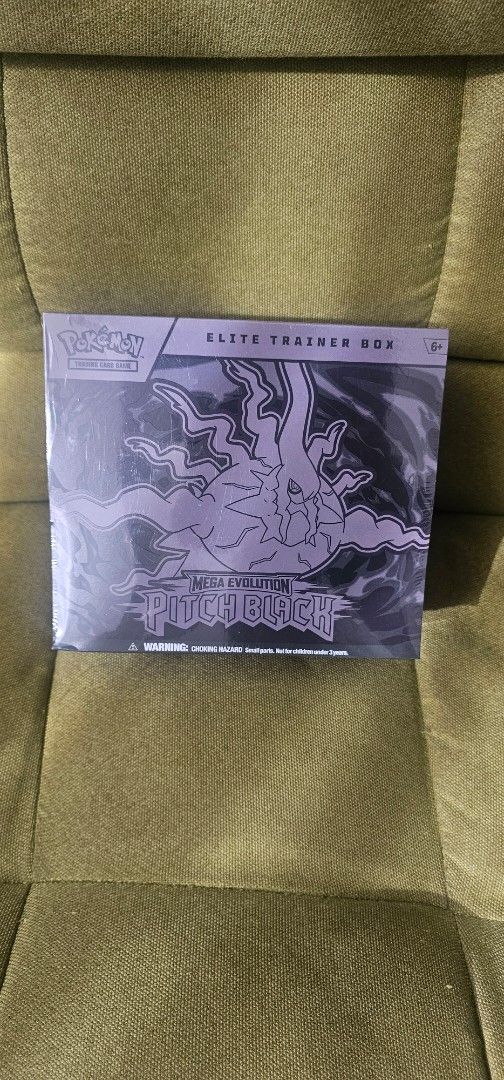 Pokémon Elite Trainer Box (ETB) English (Category: Card Boxes & Cases) located in Manila. Submitted by lugiatyphlosion01 (Listing ID 1467906546, Image 1). Description: Pokémon Elite Trainer Box labeled Mega Evolution Pitch Black. It features a dark, stylized design with a central creature illustration. it a unique addition for collectors interested in custom-made or fan-created Pokémon merchandise..