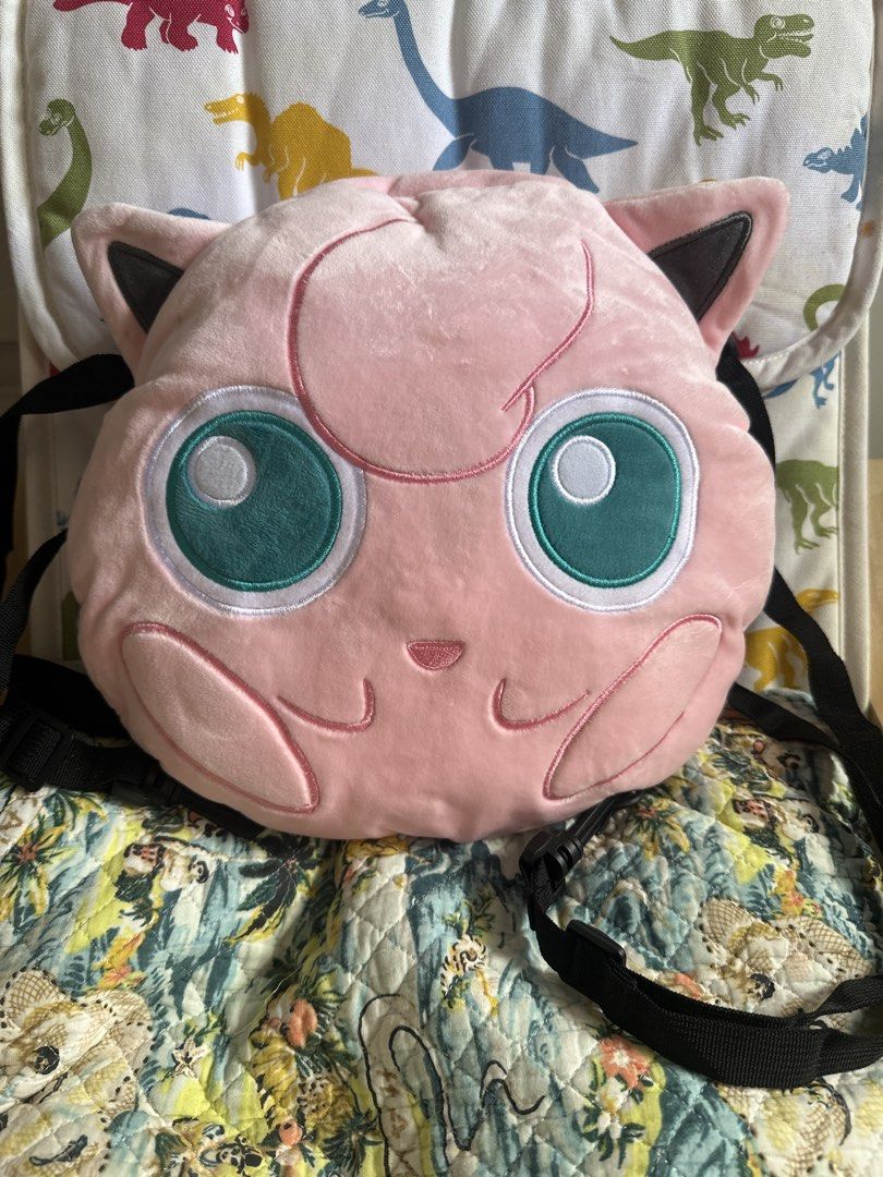 Pokémon Jigglypuff Plush Backpack (Category: Plushies & Soft Toys) located in Cainta. Submitted by shopbyyna (Listing ID 1467888293, Image 1). Description: - Authentic Pokémon merchandise licensed by Sundream (7-Eleven promotion item from HK, Macau, and Singapore) - Soft pink fuzzy exterior with large, expressive embroidered green eyes - Secure zippered top closure with a clean pink interior lining - Adjustable black straps equipped with durable 