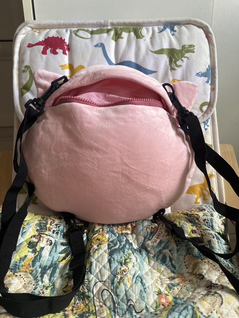 Pokémon Jigglypuff Plush Backpack (Category: Plushies & Soft Toys) located in Cainta. Submitted by shopbyyna (Listing ID 1467888293, Image 2). Description: - Authentic Pokémon merchandise licensed by Sundream (7-Eleven promotion item from HK, Macau, and Singapore) - Soft pink fuzzy exterior with large, expressive embroidered green eyes - Secure zippered top closure with a clean pink interior lining - Adjustable black straps equipped with durable 