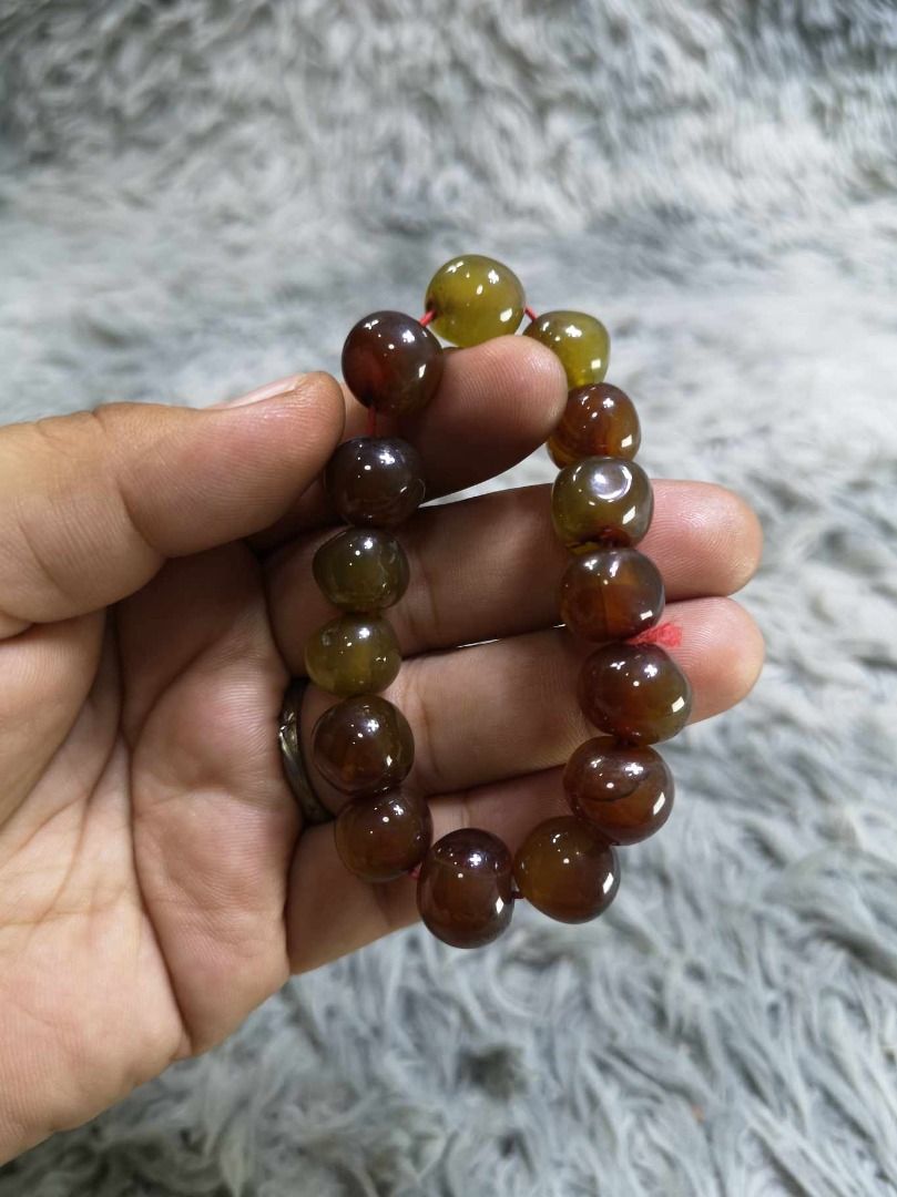 Polished Round Stone Beaded Stretch Bracelet (Category: Bracelets) located in Santa Cruz. Submitted by jmy_surplus.2 (Listing ID 1467904453, Image 2). Description: Size : L- 4 W - 0.4 Color : Brown Type : Bracelet Brand : No Brand Material : Jade Style : Brown Beaded Stretch bracelet LG 117 JMY3 Batch #225.