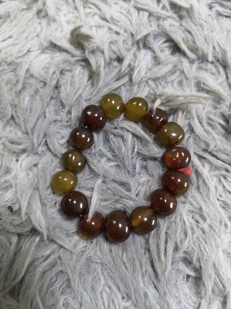 Polished Round Stone Beaded Stretch Bracelet (Category: Bracelets) located in Santa Cruz. Submitted by jmy_surplus.2 (Listing ID 1467904453, Image 1). Description: Size : L- 4 W - 0.4 Color : Brown Type : Bracelet Brand : No Brand Material : Jade Style : Brown Beaded Stretch bracelet LG 117 JMY3 Batch #225.