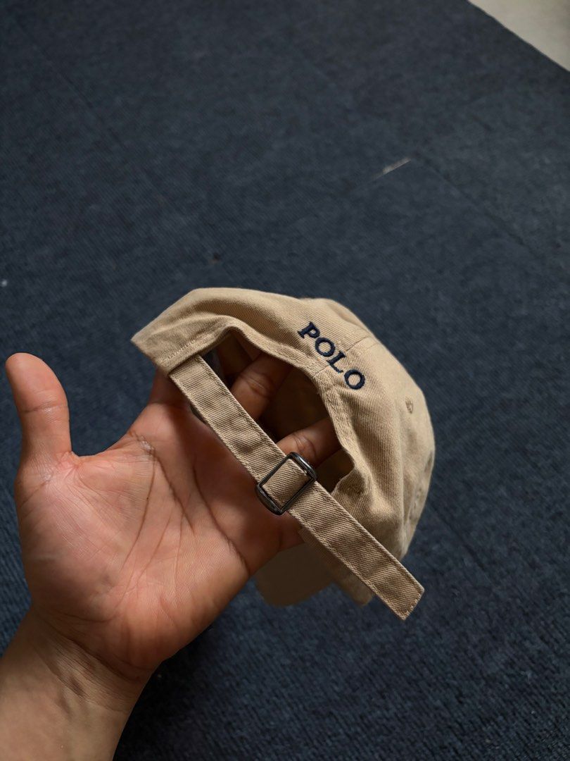 Polo Ralph Lauren Beige Baseball Cap (Category: Caps & Hats) located in Manila. Submitted by toys_hats005 (Listing ID 1467957339, Image 2). Description: - Authentic Polo Ralph Lauren baseball cap in classic beige - 100% comfortable cotton material - Signature embroidered pony logo on the front - POLO embroidery detail above the back strap - Adjustable metal buckle closure for a custom fit - One size fits most - Clean and ready to wear.