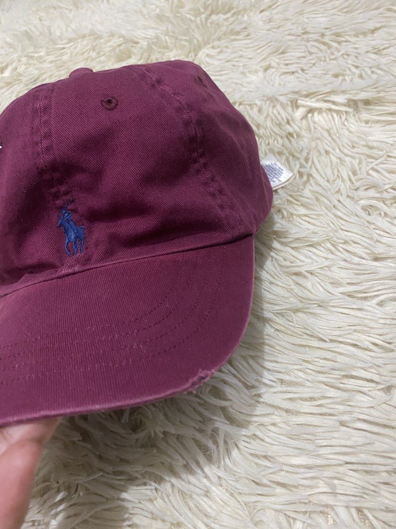 Polo Ralph Lauren Maroon Baseball Cap (Category: Caps & Hats) located in Manila. Submitted by switchcity (Listing ID 1467878139, Image 2). Description: - Brand: Polo Ralph Lauren - Color: Maroon with blue embroidered pony logo - Material: 100% breathable cotton - Details: 'POLO' embroidered above the back strap - Closure: Adjustable metal buckle for a custom fit - Sizing: One size fits all - Origin: Made in Cambodia.